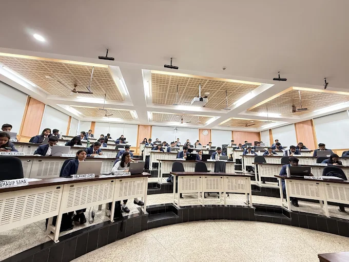 Students attending a lecture in a tiered CollegeAdda classroom
